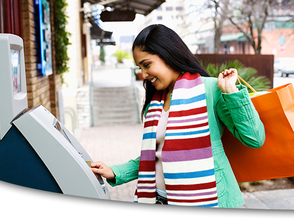 Woman using ATM