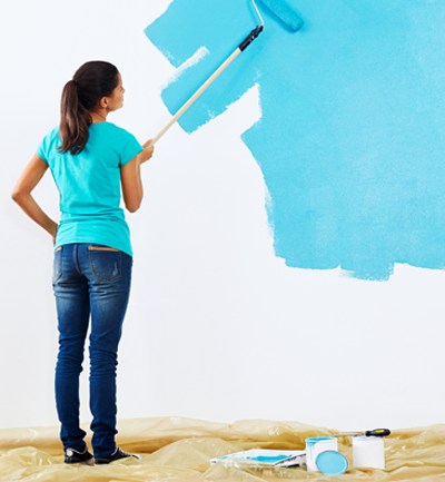 woman painting the wall