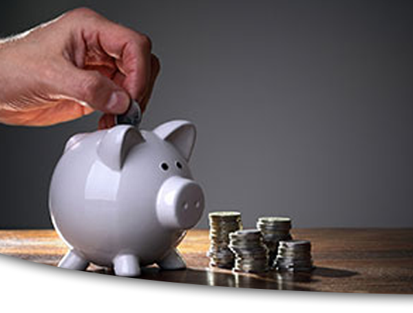 Photograph of man inserting coin into piggy bank