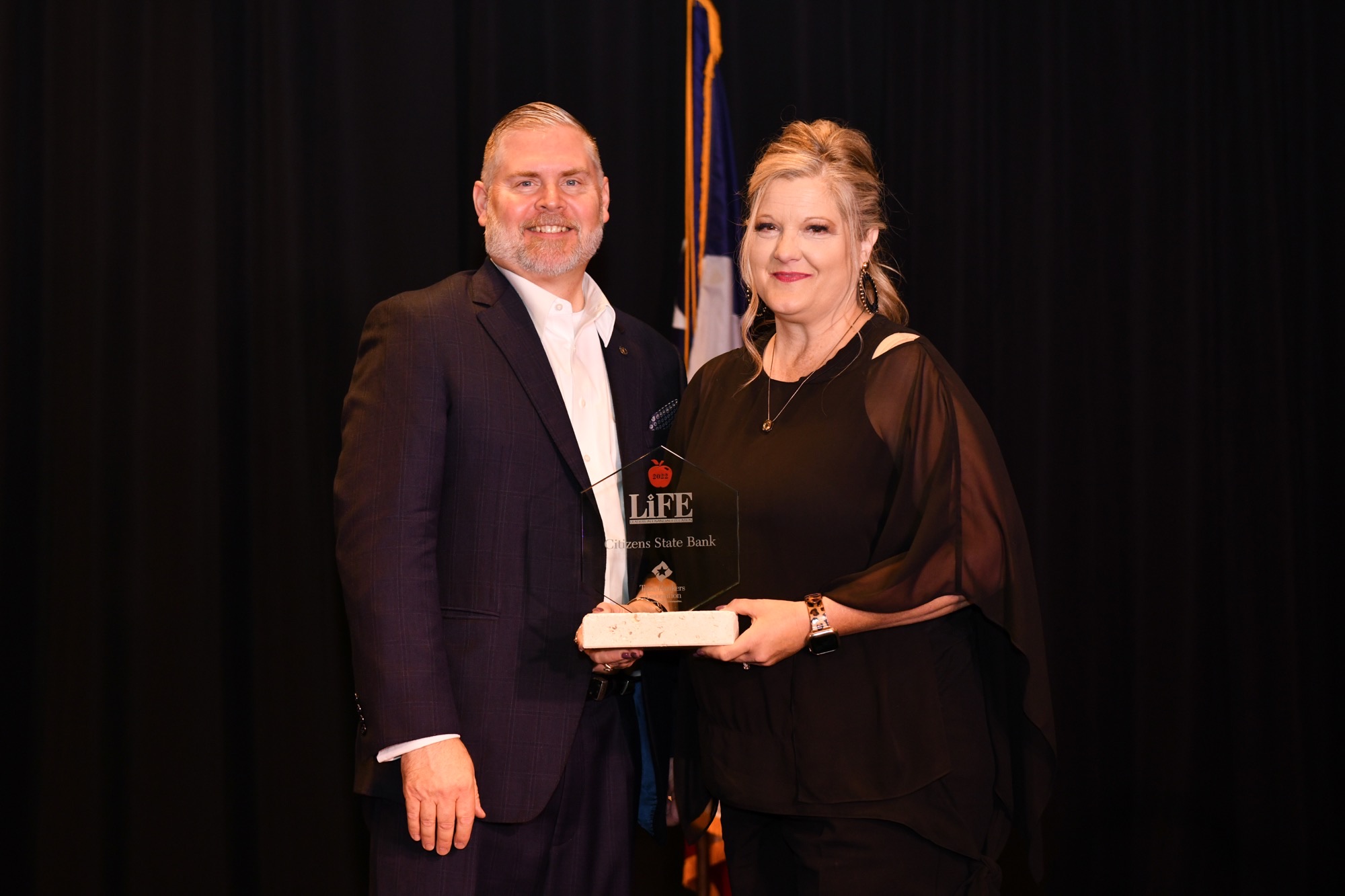 Man and Woman receiving award